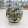 Golden Iron Pyrite Sphere (Fool’s Gold) crystal – metallic cubic surface reflecting light, symbolizing abundance, prosperity, and positive energy.