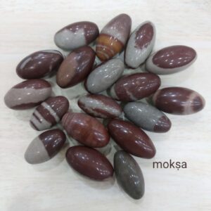 Natural Baan Linga (Banalinga) Shiva Lingam from the sacred Narmada River for Shiva puja, meditation, home temple, and spiritual worship.