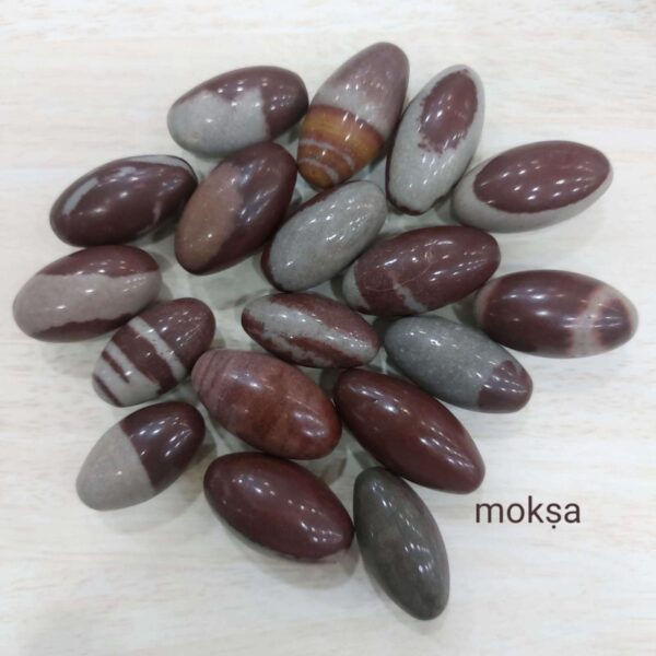 Natural Baan Linga (Banalinga) Shiva Lingam from the sacred Narmada River for Shiva puja, meditation, home temple, and spiritual worship.