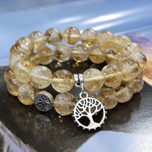 Natural AAA Citrine Crystal Bracelet with 10mm polished round golden-yellow gemstone beads on a stretch elastic cord.